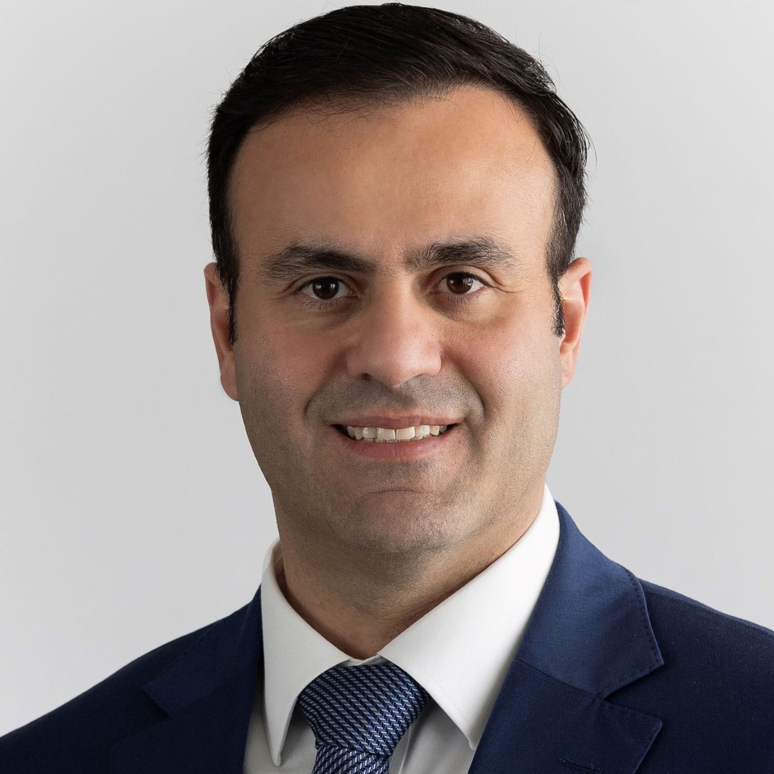 Headshot of Saker Asllan